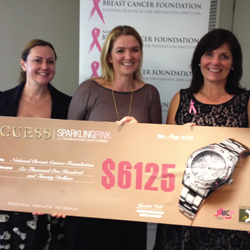 Designa Accessories' Elizabeth Thompson and Natalee Hubbard hand over a cheque to Libby Hayes of the National Breast Cancer Foundation.