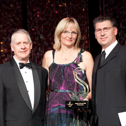 Pandora's Karin Adcock with Showcase Chairman Russell Annear and CEO Michael Mishevski