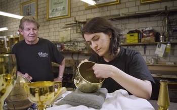 The trophy is hand-engraved.