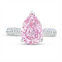 4.08-carat fancy vivid purple-pink diamond set in a ring with round diamonds along the band.