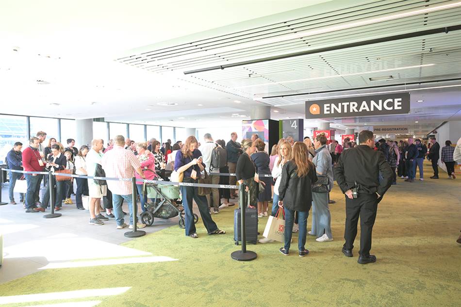 Visitors wait at the entrance of the International Jewellery Fair.