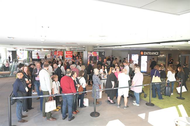 Visitors wait at the entrace of the Sydney Fair.