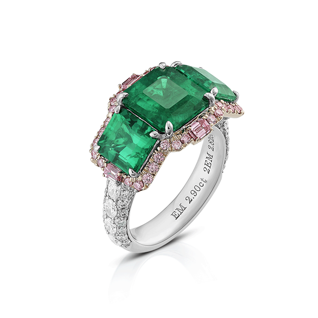 The Viridissima Ring. A feminine name meaning fresh and green. A trinity ring with three emerald-cut Muzo emeralds (cedar oil) totalling 5.72cts outlined by 0.78cts Argyle pink diamonds and 1.06cts white diamonds. Set in platinum and 18K gold