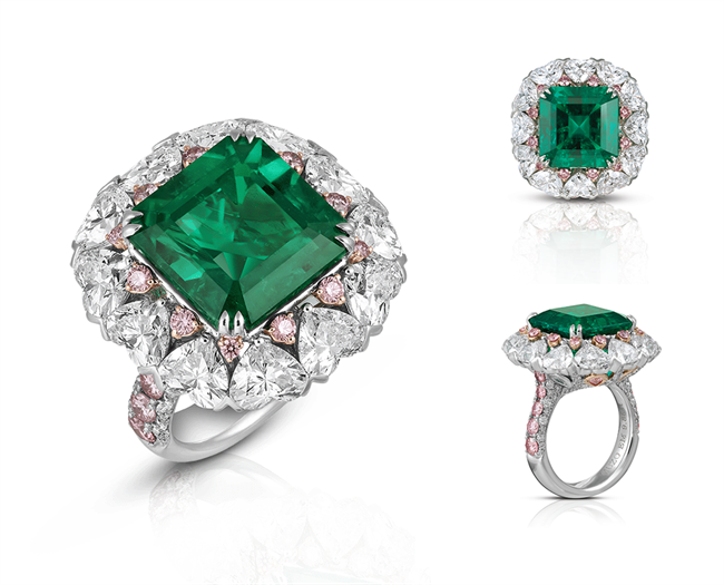 The Helena Ring: A gracious feminine name symbolising beauty and Strength. This stunning 9.88ct no oil Muzo emerald surrounded by 12 heart shape white diamonds, total 6.10cts and enhanced by 1.18cts Argyle pink diamonds, set in platinum and 12K gold