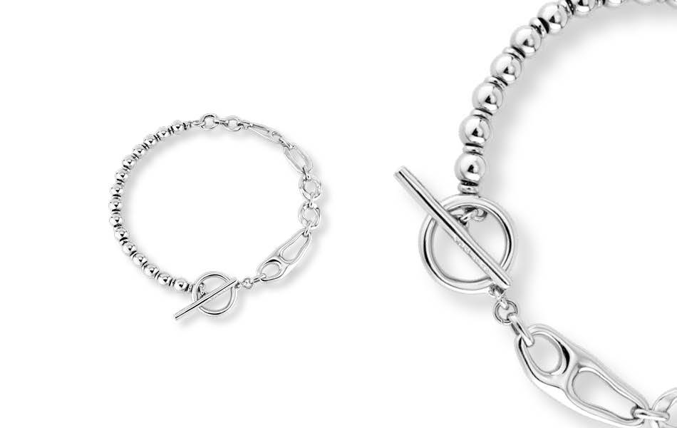 UNOde50 Cheerful Necklace: Handcrafted in Spain with distinct, organic design. Unique links, ball accents, and ring & bar clasp. Originality, artistry, and exceptional craftsmanship. | Source: UNOde50