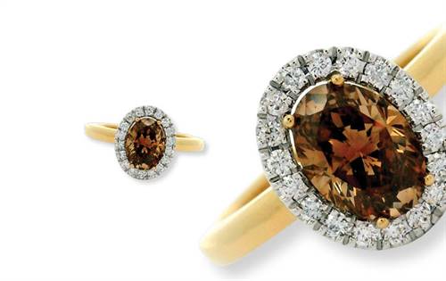Australian Diamond Trading Corporation: Alluring champagne-diamond ring featuring an oval-cut Argyle brown centrepiece stone, haloed by sparkling diamonds in 18-carat yellow gold for warm, radiant luxury. | Source: Australian Diamond Trading Corporation