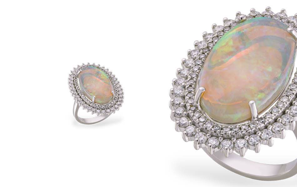 Becks:  A mesmerizing 23mm oval natural Australian opal with a delicate double halo of Argyle diamonds. Exceptional quality, individual style, treasured forever. | Source: Becks