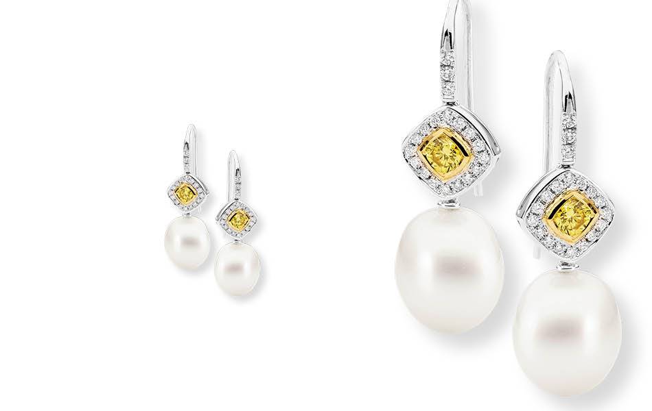 18ct white & yellow gold, featuring yellow diamonds framed by white diamonds. Luminous Australian South Sea pearls. Vibrant colour & classic sophistication.