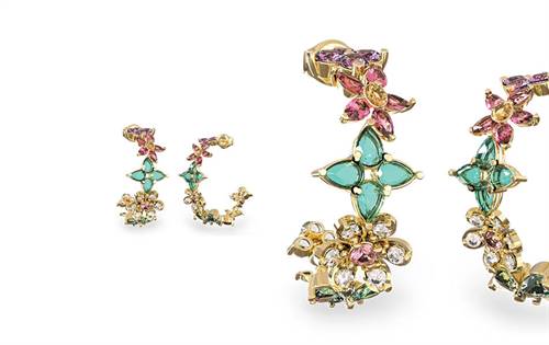 Delicate 24mm gold-tone hoops adorned with colourful crystals and floral accents. A beautifully feminine finish. Pair with matching necklace & bracelet.