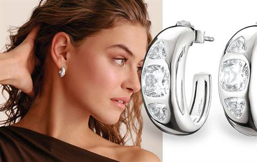 Sculptural 925 silver hoops featuring a cushion-cut & trilliant-cut zirconia. Harmonious design catches the light beautifully. Elegant and eye-catching.