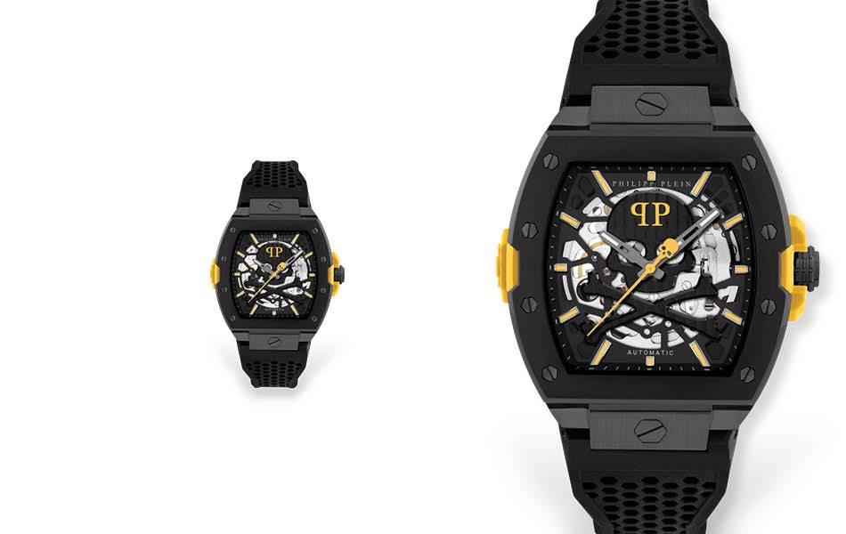 Reimagined iconic design with modern silicone construction. Striking skeletonised dial reveals intricate mechanics in a 44mm IP black case. Unmistakable branding. | Source: Philipp Plein - Designa Accessories