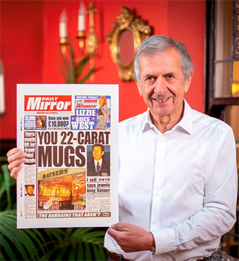 Gerald Ratner holds up a front-page headline about his infamous 1991 speech that famously derailed his jewellery empire.  |  Photo by Adam Gerrard, Daily Mirror