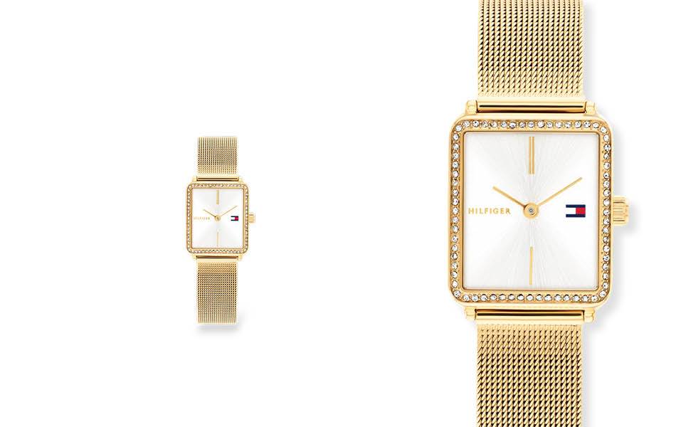 Crystal-set rectangular case, gold-tone mesh bracelet, clean silver-white dial — elegant, refined and jewellery-styled. | Source: Tommy Hilfiger