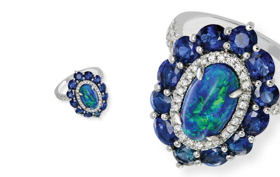 18ct white gold, 2.60ct black opal, halo of blue sapphires and white diamonds — bold, luxurious and vibrant. | Source: Sapphire Dreams