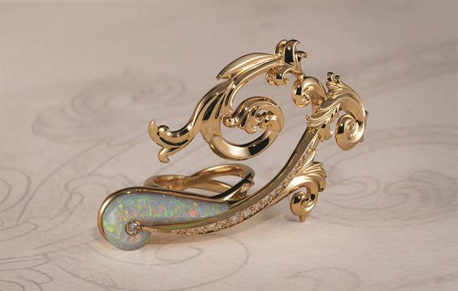 Jamboree: Bold, architectural forms of the Acanthus leaf, described as a historic motif brought to life through sculptural, three-dimensional detailing and a South Australian opal.