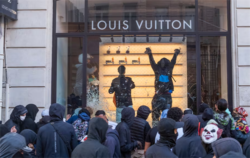 Violent protests targeting major luxury brands have highlighted the tension between aspirational appeal, social inequality, and the secondary market for high-end goods. | Source: The Business of Fashion