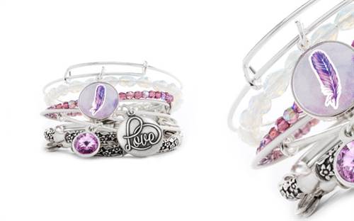 Alex and Ani’s Art Infusion Feather Charm bangle stacked with other items 