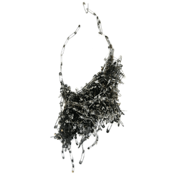 One of Kiuru's winning pieces - a neckpiece made from brass and stainless steel safety pins, coated with liquid enamel and torch hand fired